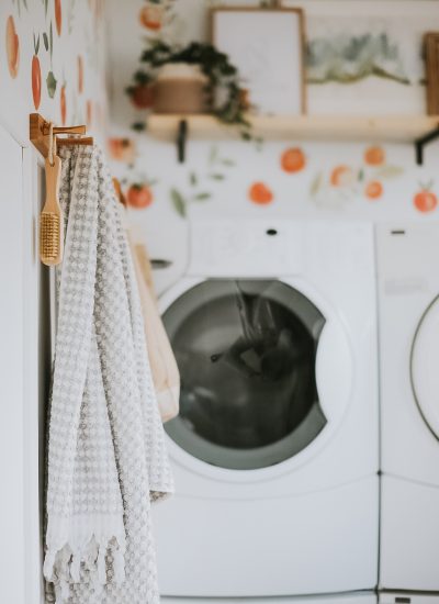 One Room Challenge - Laundry Room Makeover. How We DIY'd and Completely transformed this ugly old laundry room for under 200 dollars! Bright and Happy Laundry Room Makeover